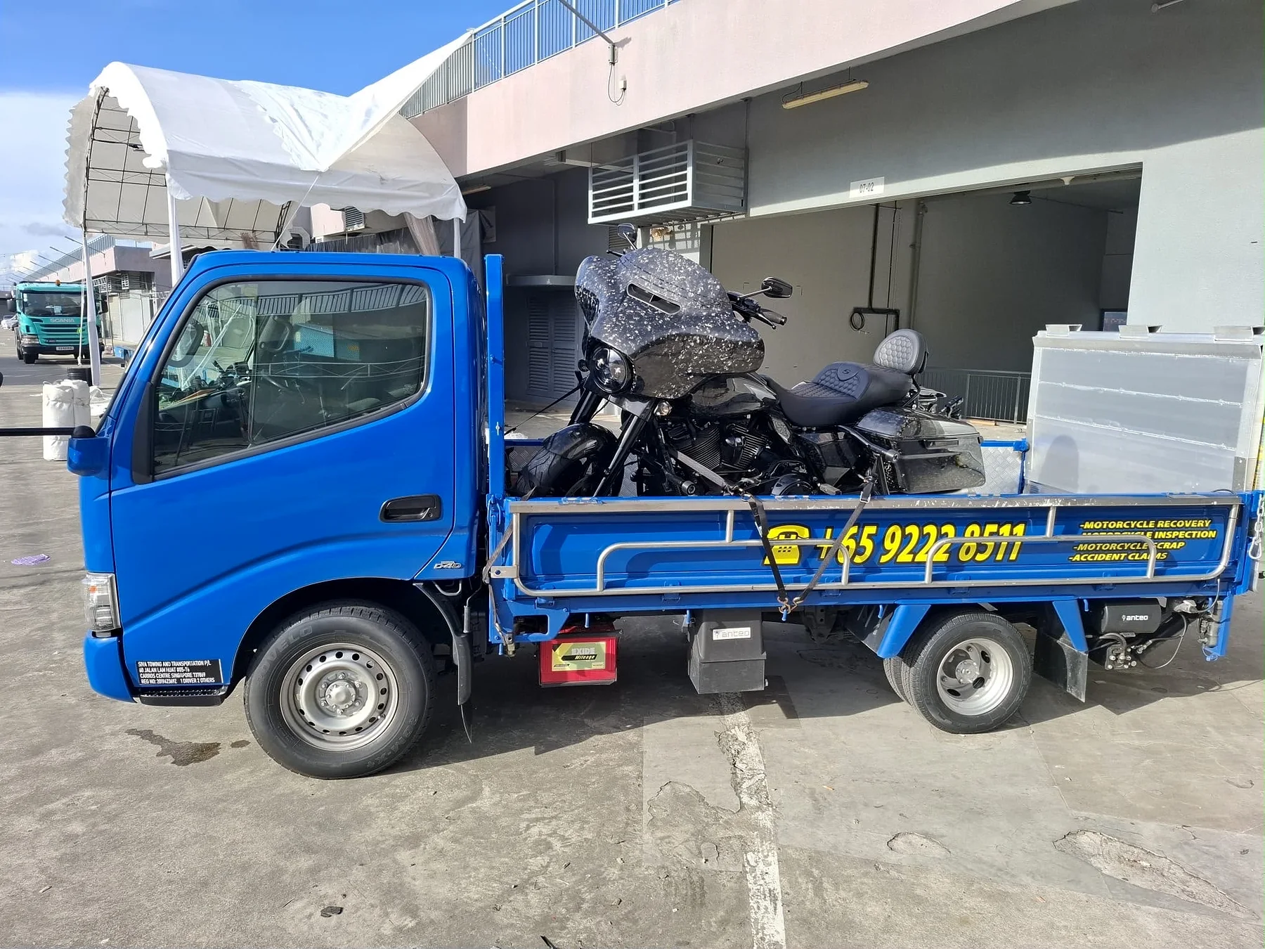 Motorcycle loaded on a Siva Towing lorry after a breakdown in Singapore