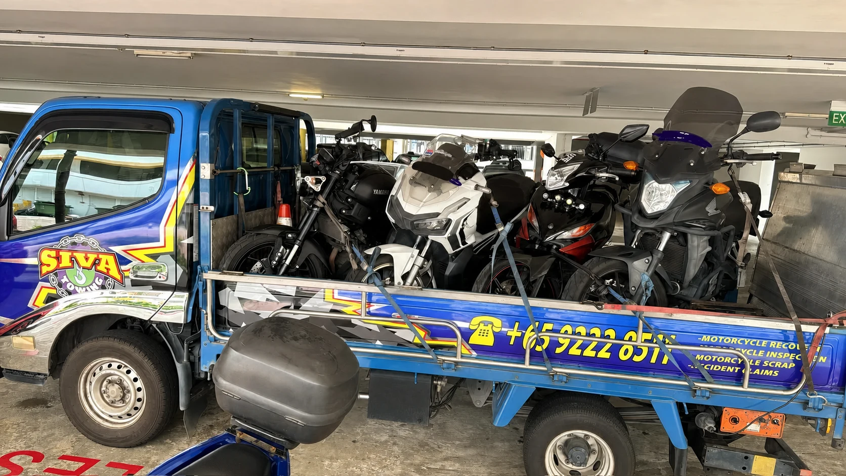 Motorcycles loaded on a Siva Towing vehicle for an authorised collection