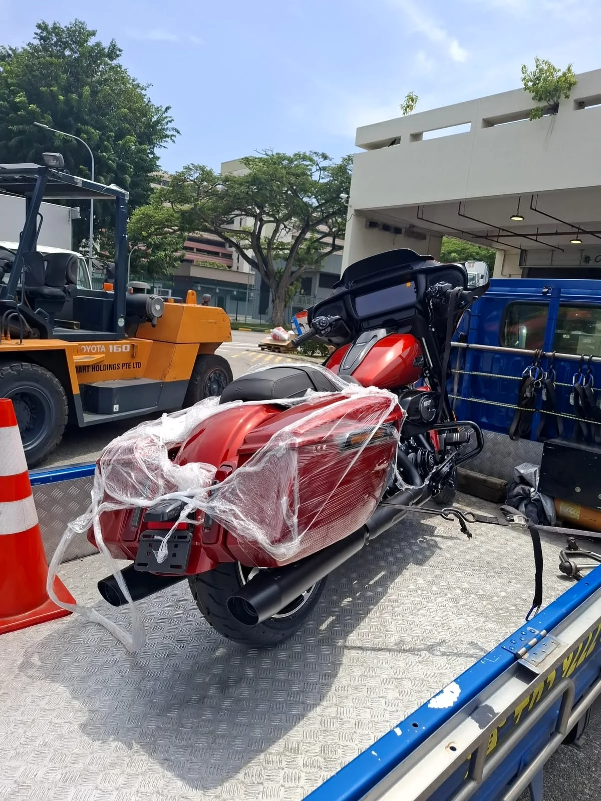 Motorcycle being prepared for secure transport by Siva Towing